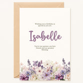 Celebrate your loved one’s birthday with a card as unique as they are. This premium greeting card showcases a delicate bouquet of watercolor flowers in gentle lavender, blush, and cream tones, elegantly framing your chosen name in a modern script font. The front reads: